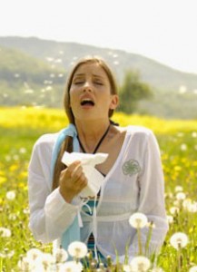 Photo of a woman in a pollen-filled field