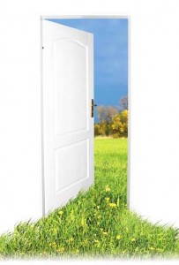 Photo of a door opened to a nature scene