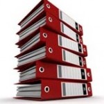 Photo of a pile of red ring binders