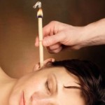 Photo of a woman receiving ear candling treatment