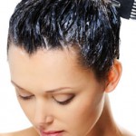 Photo of a woman using hair dye