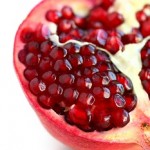 Photo of a pomegranate with seeds exposed