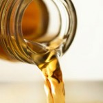 Photo of apple cider vinegar being poured from a bottle