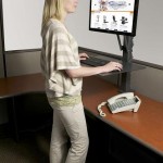 Photo of a woman at a standing desk